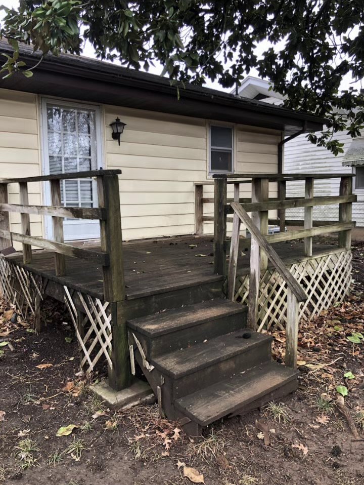 Dirty, mildewed wood deck and stairs before pressure washing