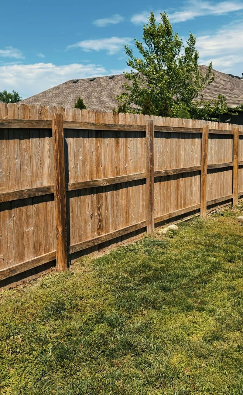 Same wood privacy fence cleaned and freshly stained