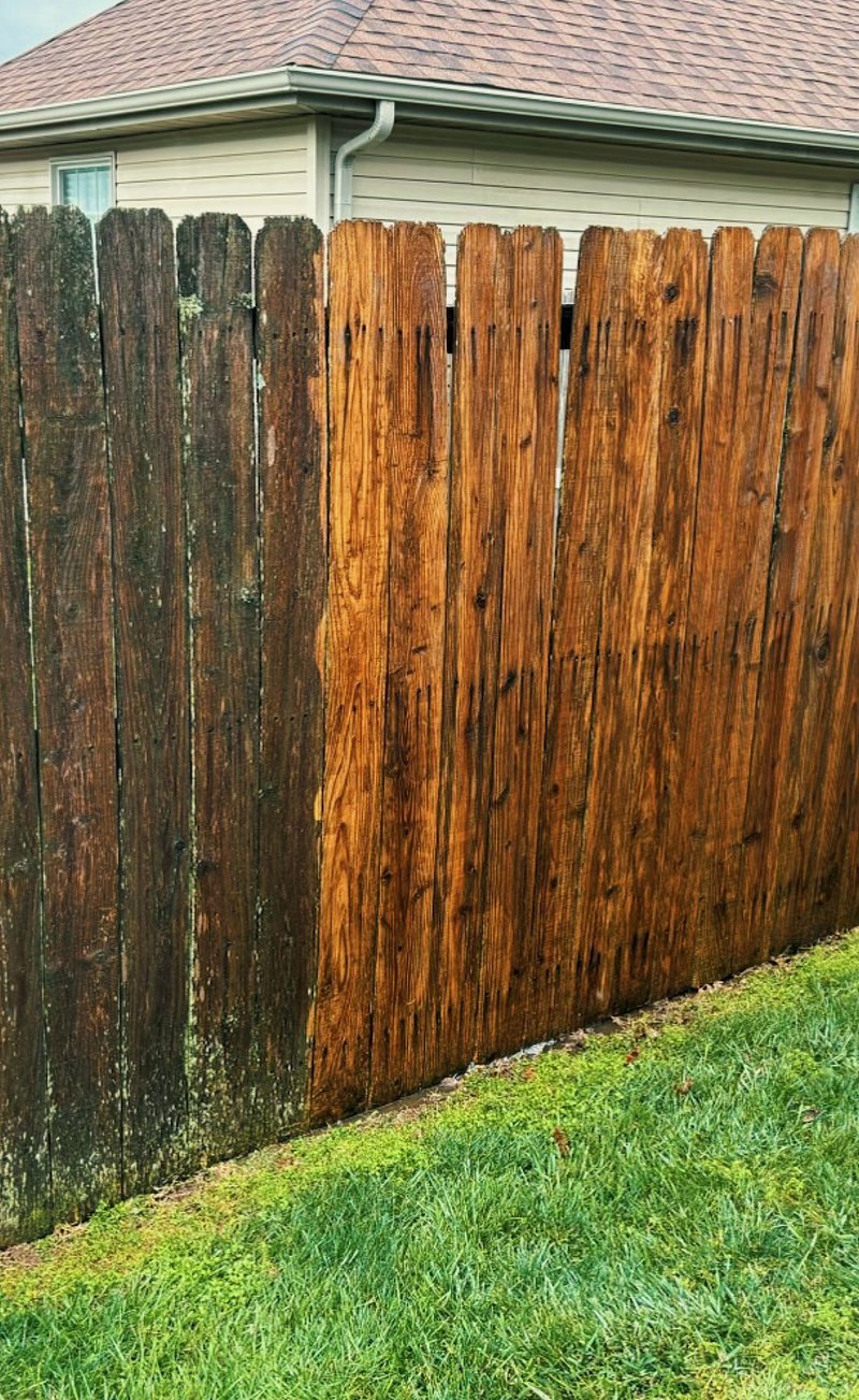 Close-up of rich stained fence boards after staining